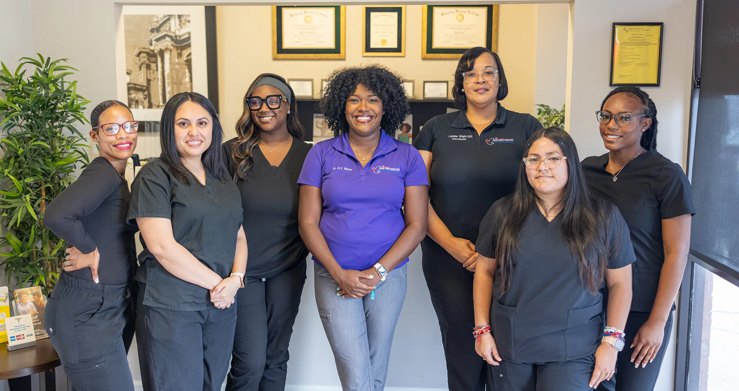 Dove Family Dentistry team members posing together in dental office interior