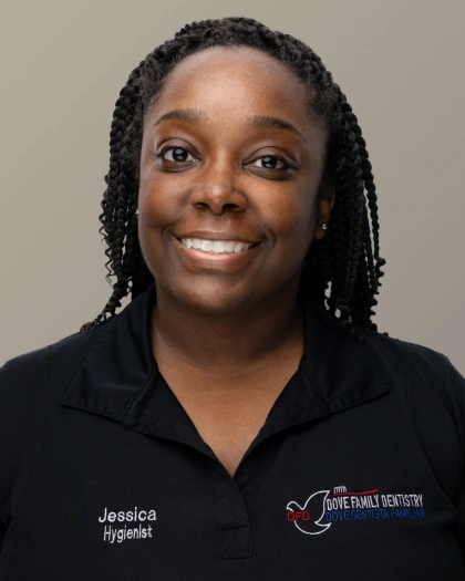 Jessica, dental professional at Dove Family Dentistry, smiling in professional headshot against neutral background.
