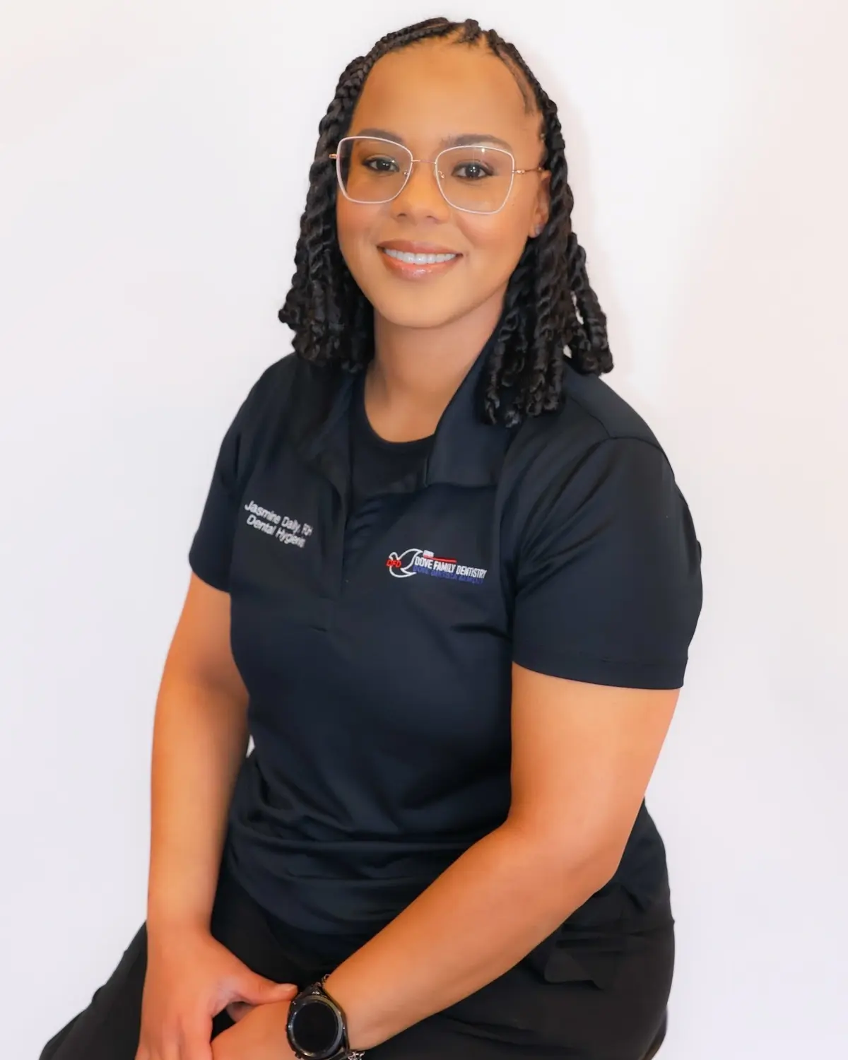 Jasmine Daily, dental hygienist at a Memphis family dentistry practice, smiles for a professional headshot.